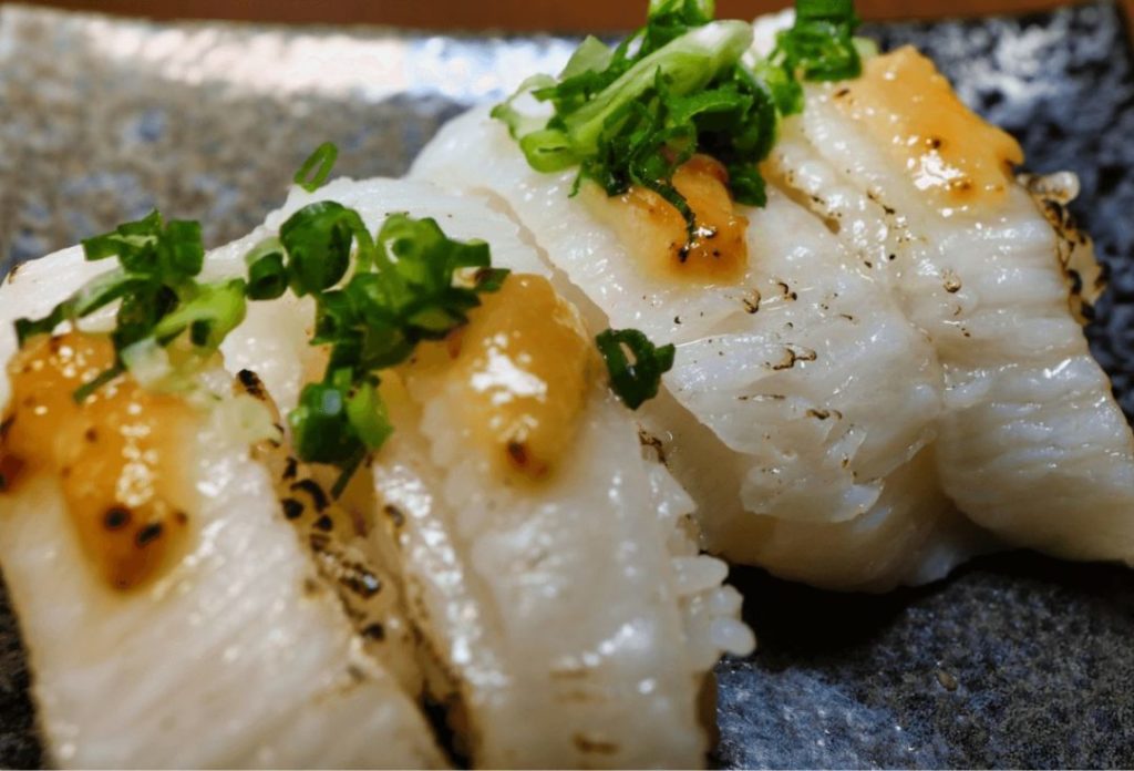 Sushi with fish fillet of which surface is seared